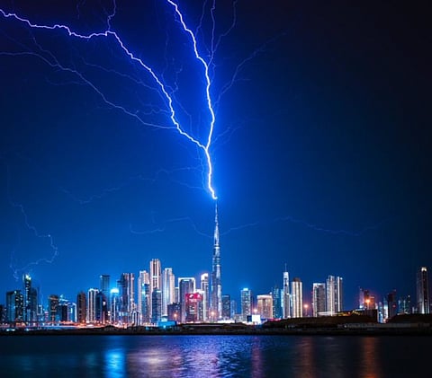 A blinding bolt tears through the storm and strikes the lightning rod atop the Burj Khalifa, as thunder rolls across Dubai and relentless rain lashes the UAE skyline. Flashes of lightning and booming thunder were reported overnight on Thursday into Friday (March 27) as weathermen sent out flash flood alerts, amid an intense weather system sweeping through the Emirates.