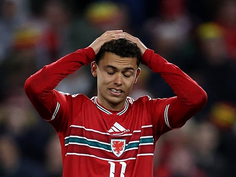Wales' midfielder Brennan Johnson reacts after failing to score a penalty during the FIFA World Cup qualification semi-final football match between Wales and Bosnia and Herzegovina, at Cardiff City Stadium, in Cardiff, on March 26, 2026.