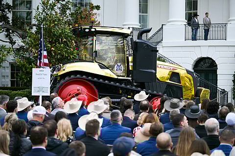 Attendees listen to US President Donald Trump deliver remarks to farmers from the Truman balcony of the White House in Washington, DC, on March 27, 2026.