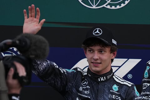 Mercedes driver Kimi Antonelli of Italy waves after the qualifying session of the Japanese Formula One Grand Prix at the Suzuka Circuit in Suzuka, Japan, Saturday, March 28, 2026. (AP Photo/Hiro Komae)