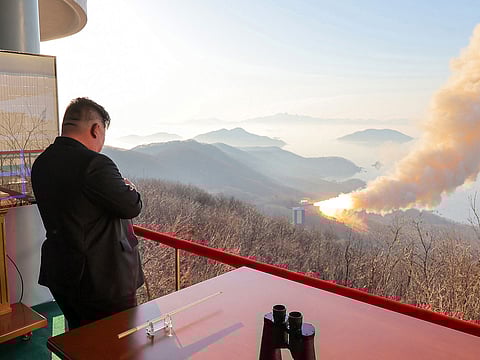 North Korean leader Kim Jong Un inspecting a combustion test of a solid-fuel rocket engine at an undisclosed location in North Korea.