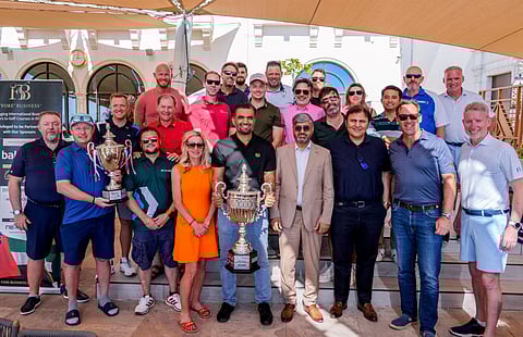 Muhammed Kalim with trophy with the golfers from UK, Spain and UAE.