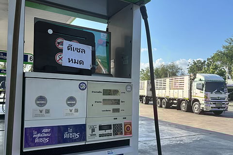 FILE - A sign announcing 'Diesel fuel has run out' is displayed on a gas staton, in Prajuab Kirikhan, Thailand, Wednesday, March 18, 2026. (AP Photo/Grant Peck, file)