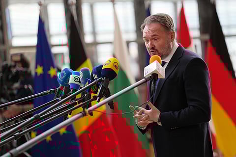 European Commissioner for Energy and Housing Dan Jorgensen speaks with the media as he arrives for a meeting of EU energy ministers at the European Council building in Brussels, Monday, March 16, 2026. (AP Photo/Virginia Mayo)