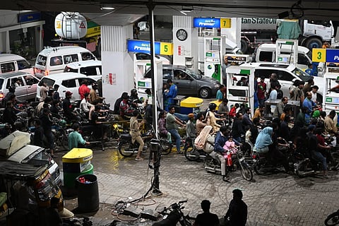 Clients queue at a gas station amid rising petrol prices in Karachi on April 3, 2026.
