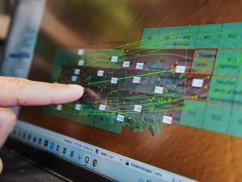 An archaeologist points to a computer screen, showing a map of the wreck of Danish flagship "Dannebroge" that sank during the Battle of Copenhagen in 1801.