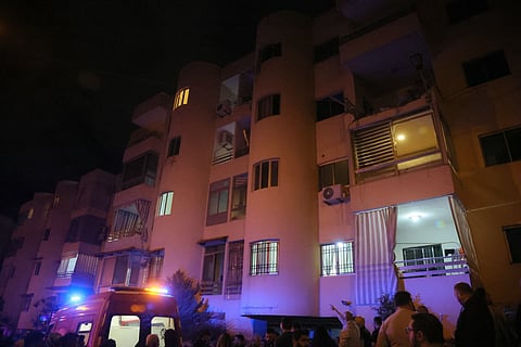 First responders gather at the site of an Israeli strike that targeted an apartment in the town of Ain Saade east of Beirut on April 5, 2026.
