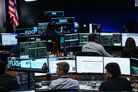 Artemis II flight controllers monitor the Orion spacecraft from the White Flight Control Room at Johnson Space Center in Houston, Texas, on April 6, 2026.