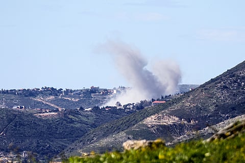 Smoke rises from a target inside Lebanon after an Israeli strike.