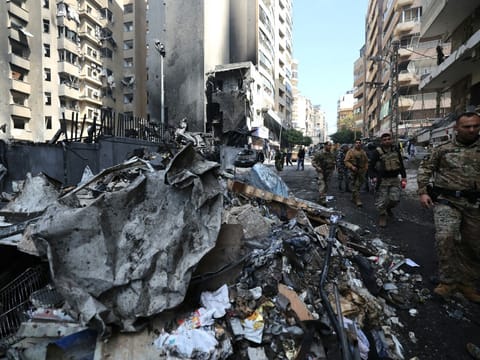 Lebanese army soldiers secure the site of an Israeli airstrike that targeted a building the day before in Beirut's Corniche al-Mazraa neighbourhood on April 9, 2026.