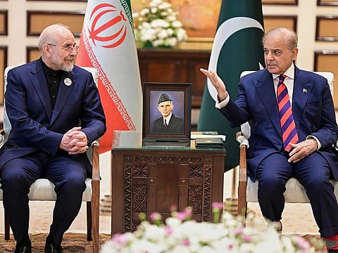Iran's Parliament Speaker Mohammad Bagher Ghalibaf, left, meets with Pakistani Prime Minister Shehbaz Sharif, in Islamabad, Pakistan