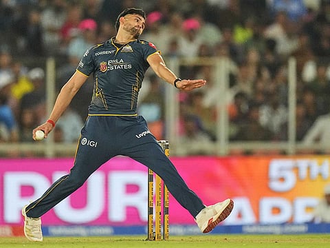 Gujarat Titans' Ashok Sharma bowls a delivery during the IPL match against Rajasthan Royals in Ahmedabad, on Saturday, April 4, 2026.