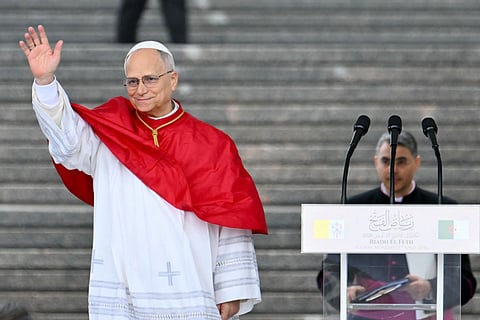 Pope Leo XIV greets people after a speech at the Maqam Echahid Martyrs’ Monument in El Madania, near Algiers on April 13, 2026.