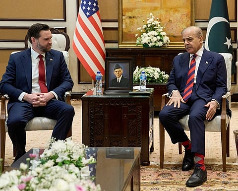 US Vice President JD Vance (L) speaks with Pakistani Prime Minister Shehbaz Sharif ahead of their meeting on Iran amid the US-Iran peace talks in Islamabad. File photo taken on April 11, 2026.