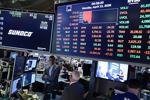 Stock market numbers are displayed on the floor of the New York Stock Exchange during morning trading.