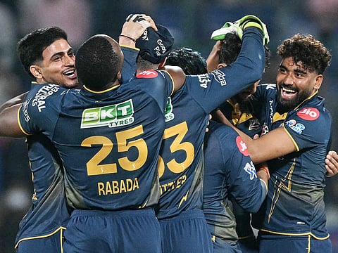 Gujarat Titans' players celebrate after winning against Delhi Capitals at the end of their 2026 IPL match in the Arun Jaitley Stadium of New Delhi on April 8, 2026.
