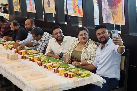 A resident takes a selfie while having sadhya at Calicut Notebook Restaurant in Lulu Hypermarket, Al Qusais as they celebrate Vishu on Wednesday.