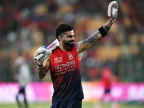 Royal Challengers Bengaluru's Indian cricket player Virat Kohli gestures before the start of the 2026 Indian Premier League (IPL) T20 match between Royal Challengers Bengaluru and Lucknow Super Giants at the M Chinnaswamy Stadium