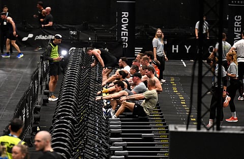 Visitors perform during indoor fitness competition Hyrox event at the FIBO trade show for health, fitness and wellness in Cologne, western Germany on April 16, 2026.