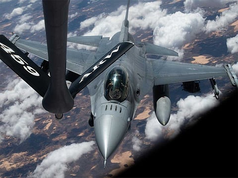 A US Air Force F-16 Fighting Falcon refuels mid-air from a KC-135 Stratotanker over the US Central Command area of operations.