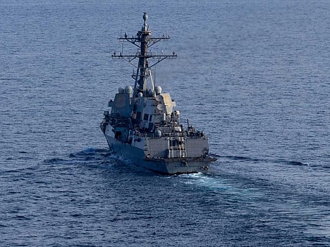 The guided-missile destroyer USS Michael Murphy (DDG 112) patrols the Arabian Sea on Friday, April 17, as US forces enforce a naval blockade on vessels attempting to enter or leave Iranian ports.
