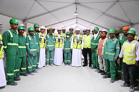 Officials review facilities and engage workers at Arab Construction Company site in Dubai