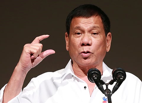 FILE - In this Oct. 26, 2016 file photo, Philippine President Rodrigo Duterte delivers a speech at the Philippine Economic Forum in Tokyo. (AP Photo/Eugene Hoshiko, File)