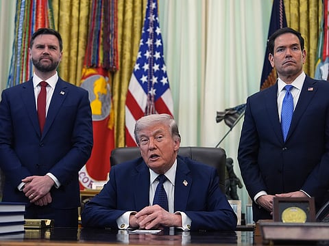 President Donald Trump speaks as Secretary of State Marco Rubio, right, and Vice President JD Vance listen in the Oval Office at the White House, Thursday, April 23, 2026, in Washington.