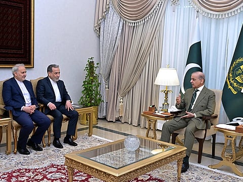 Iran's Foreign Minister Abbas Araghchi, second left, meets with Prime Minister Shehbaz Sharif, in Islamabad, on Saturday, April 25, 2026.