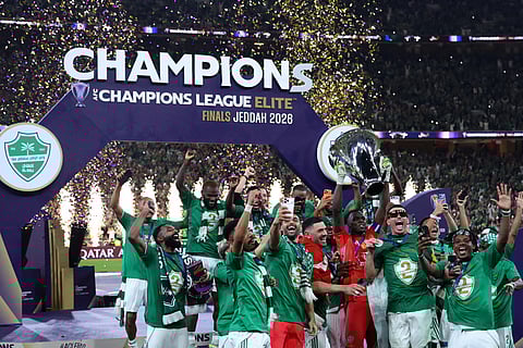 Al-Ahli players celebrate with the trophy after beating Machida Zelvia 1-0 in the final of the AFC Champions League football match between Al-Ahli Saudi FC and FC Machida Zelvia at the King Abdullah Sports City, in Jeddah on April 25, 2026.
