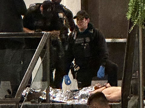Members of law enforcement control shooting suspect Cole Tomas Allen during the White House Correspondents Dinner in Washington.