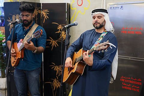 Mohamed Al Zarooni, Dubai-based Emirati singer-songwriter performing, along with his band Zarooni Sound Society at Neighbourhood Food Hall in Green Community Motor City.