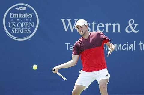 Dominic Thiem of Austria hits a return shot to Milos Raonic of Canada during a quarterfinal match on Day 7 of the Western & Southern Open at the Lindner Family Tennis Center on August 19, 2016 in Mason, Ohio.