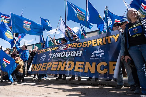 Separatist supporters gather during a rally in front of the Elections Alberta headquarters in Edmonton, Canada, on May 4, 2026, as they submit boxes of signatures in the hope of triggering an independence referendum.