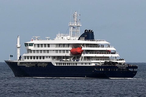 The MV Hondius cruise ship departs the port in Praia, Cape Verde, Wednesday, May 6, 2026.