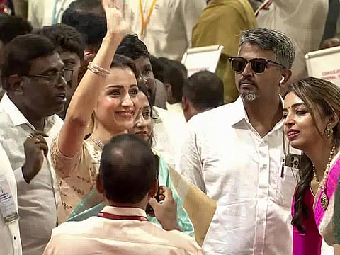 Actress Trisha Krishnan arrives to attend the oath-taking ceremony of TVK chief Joseph Vijay as Chief Minister of Tamil Nadu at the Jawaharlal Nehru Stadium, in Chennai on Sunday.