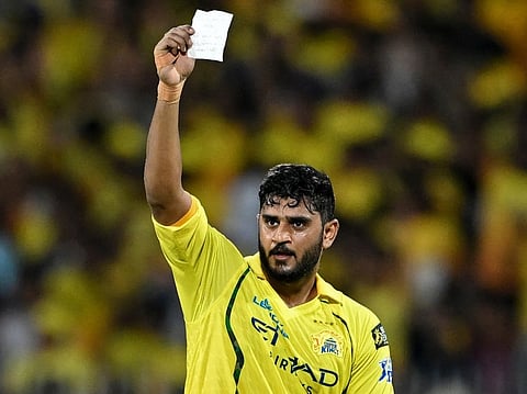 Chennai Super Kings' Indian cricket player Urvil Patel holds up a note as he celebrates after scoring a half-century (50 runs) during the 2026 Indian Premier League (IPL) T20 match between Chennai Super Kings and Lucknow Super Giants