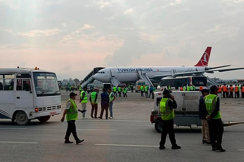 A Turkish Airlines aircraft is seen after passengers were safely evacuated following a fire on the jet while landing in Kathmandu.
