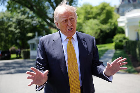 President Donald Trump speaks to the press as he departs the White House on May 12, 2026 in Washington, DC. Trump is traveling to China where he is scheduled to meet with Chinese President Xi Jinping for expected talks on the Iran conflict, trade imbalances, regional security, and economic cooperation between the two countries.