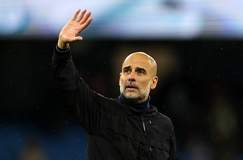 Manchester City's Spanish manager Pep Guardiola waves to the fans following the English Premier League football match between Manchester City and Crystal Palace at the Etihad Stadium in Manchester, north west England, on May 13, 2026