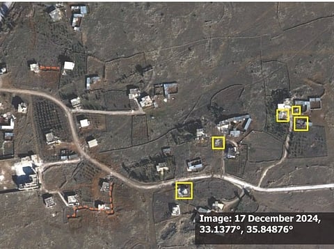 Satellite imagery from 7 July 2024 (top) shows Rassim al-Rawadi village. On 17 December 2024 (bottom), yellow squares highlight six structures that appear heavily damaged or destroyed. Newly built berms are highlighted with orange dashed lines. Trees are removed on the west side of the main road.