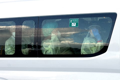 A bus carrying passengers caught up in the MV Hondius hantavirus outbreak, arrives at a purpose-built quarantine facility located on the outskirts of the Western Australian city of Perth on May 15, 2026.