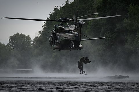 French Foreign Legion combat divers from the 2nd Foreign Parachute Regiment (2e REP) leap from a NH90 Caïman helicopter into the River Vienne during an airborne water insertion exercise in Ingrandes, south-western France, on May 18, 2026.