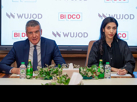 Shamsa Sulaiman Alfahim and Issa Ataya at the agreement signing ceremony.