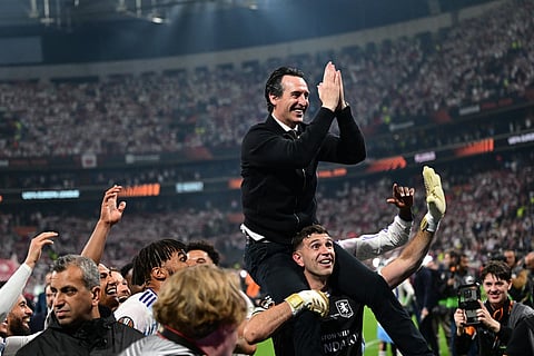 Aston Villa's Spanish manager Unai Emery celebrates with his players after winning the UEFA Europa League final football match between SC Freiburg and Aston Villa at Besiktas Park in Istanbul on May 20, 2026.