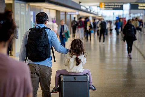 Travellers move through Washington Dulles International Airport on May 22, 2026, in Dulles. Image used for illustrative purposes.
