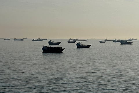 Vessels are seen anchored in the Strait of Hormuz, off the port city of Khasab on Oman’s northern Musandam Peninsula on May 17, 2026.