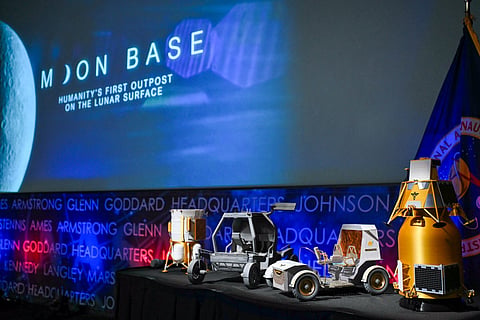 Models of lunar rovers and landers are displayed during a news conference at NASA headquarters in Washington, DC, on May 26, 2026, to outline plans for NASA's "Moon Base" lunar base and progress toward a sustained human presence on the Moon.