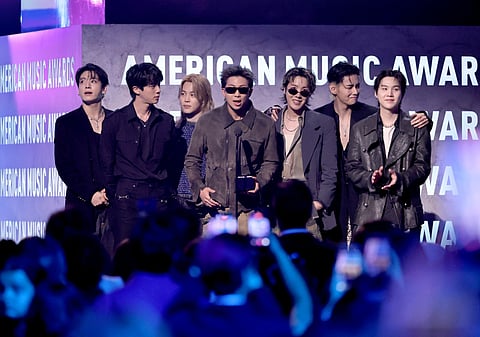 Jungkook, Jin, Jimin, RM, J-Hope, V and Suga of BTS accept the Artist of the Year award onstage during the 52nd American Music Awards at MGM Grand Garden Arena on May 25, 2026 in Las Vegas, Nevada.