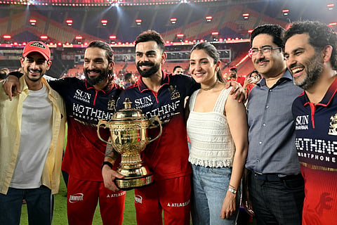Royal Challengers Bengaluru's Indian cricket players captain Rajat Patidar (2L) and Virat Kohli (3L) alongside his wife and Bollywood actress Anushka Sharma (3R) celebrate after their team's win against Gujarat Titans at the end of the 2026 Indian Premier League (IPL) T20 final match in the Narendra Modi Stadium of Ahmedabad on June 1, 2026.